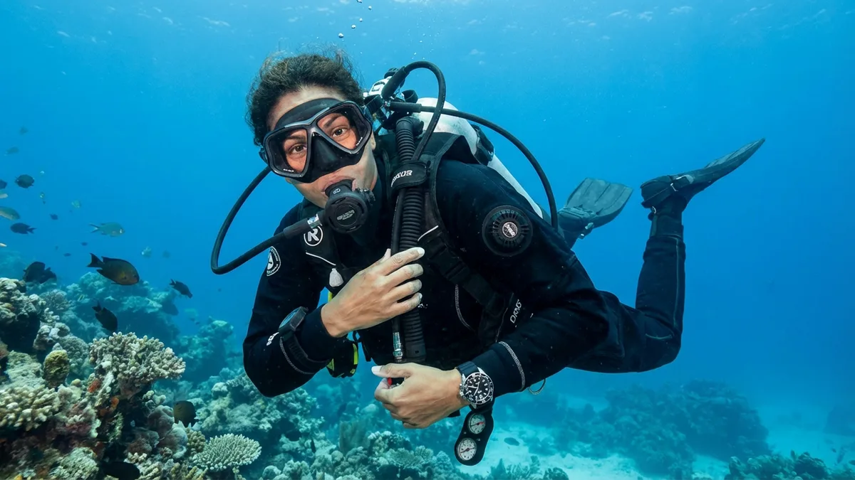 How do you inflate and deflate a BCD underwater?